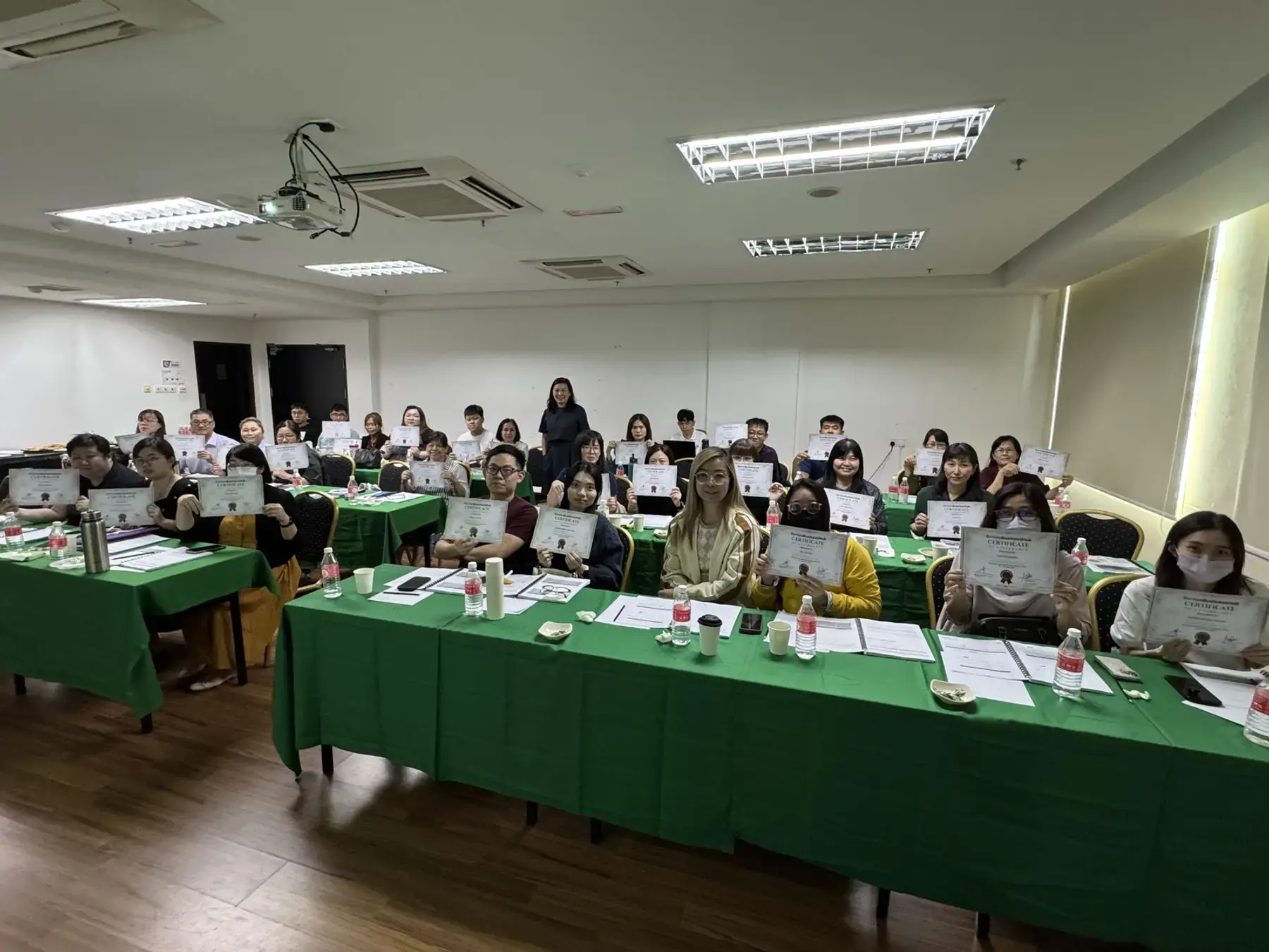 A classroom workshop with certificates presented